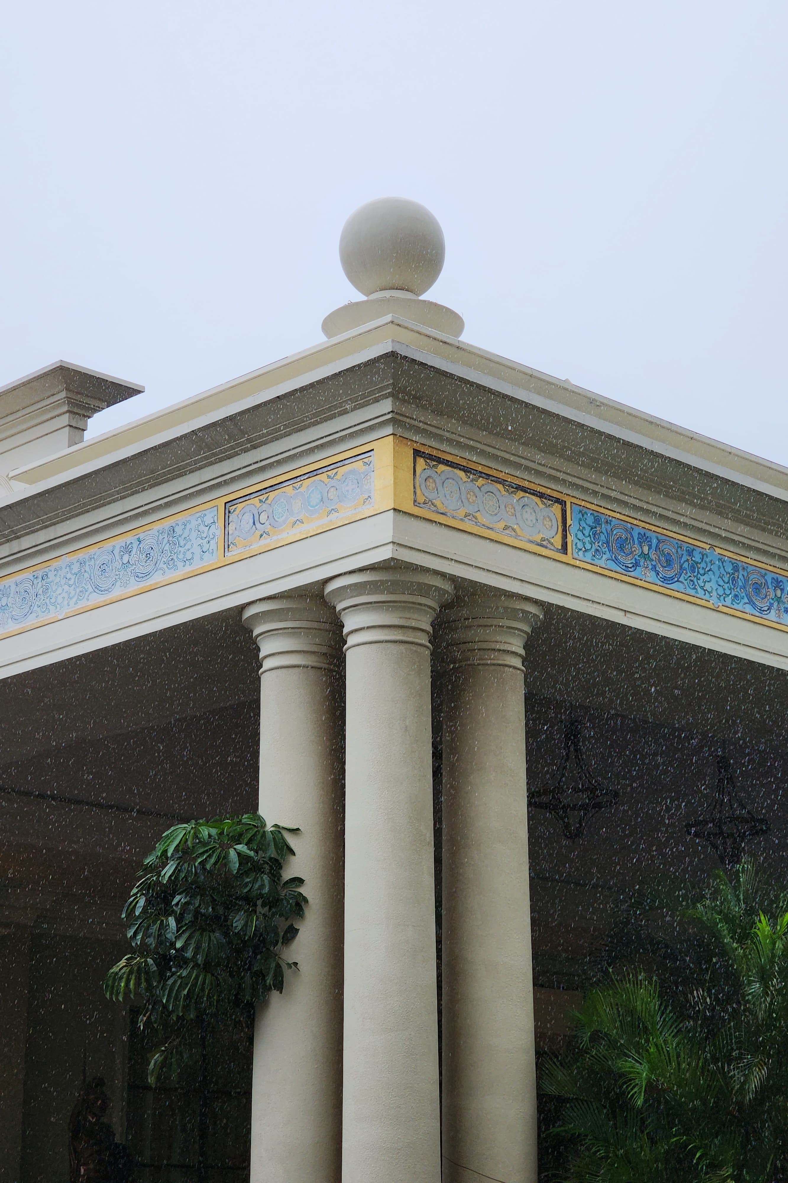 Rain drops falling in front of a old architecture building